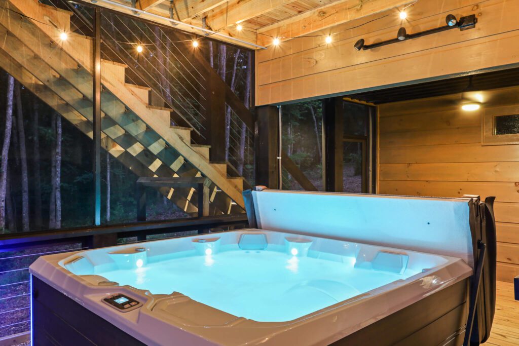 hot tub in a luxury cabin rental in blue ridge, georgia - boujee lodge